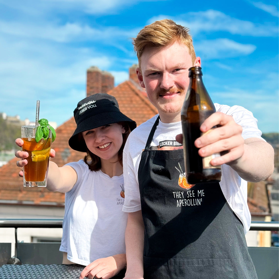 The Weinspirits founders with drinks on a rooftop